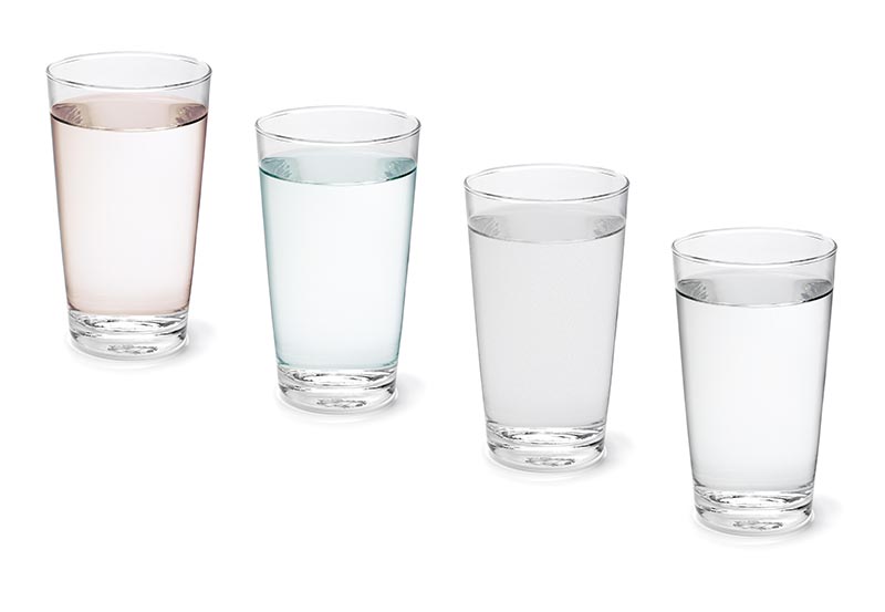 Single glass with clean drinking water on white background close up Single glass with clean drinking water isolated on white background close up